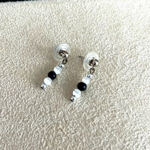 White and black dangling stud earrings